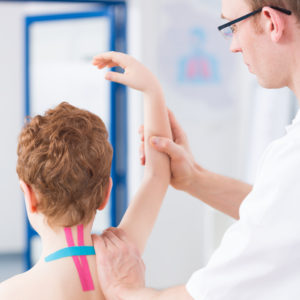 boy-during-kinesio-taping-therapy