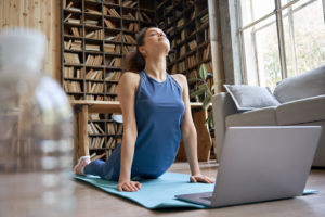 girl-doing-online-yoga-exercise-wellnest